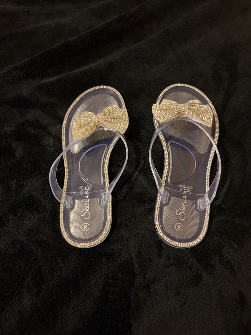 Clear Jelly Bow Flip Flop Sandals in Gold Accent